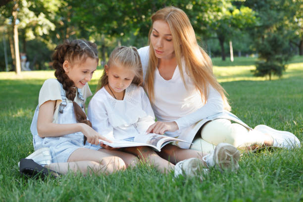 istock Kids studying outdoors in the park 1260421734