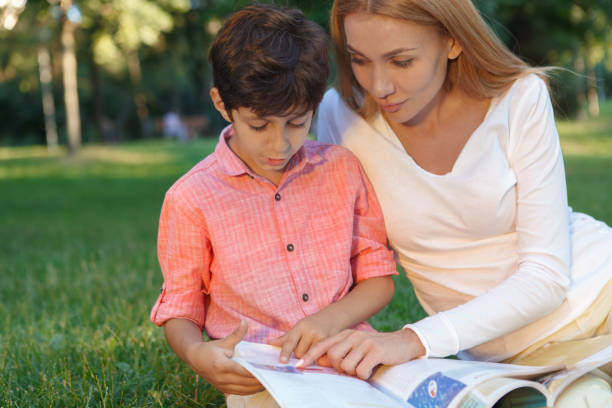 istock Female teacher and her student outdoors 1260424189