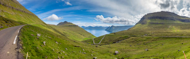 mountain roads panorama, faroe islands winding mountain roads at the fjords of eysturoy island, faroe islands. eysturoy stock pictures, royalty-free photos & images