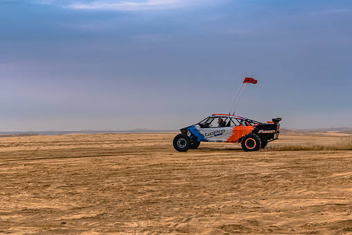 Mazra'at Turayna, Qatar - January 9, 2020: Buggy dragster racing in the sand desert.