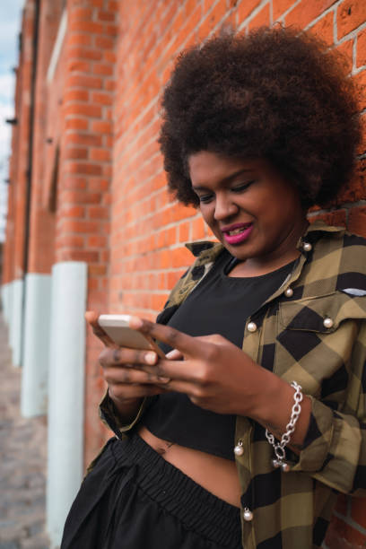 istock Young woman using her mobile phone. 1260444679