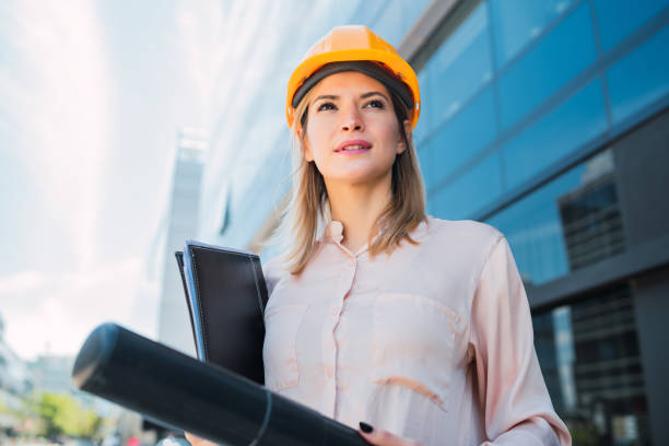istock Professional architect woman standing outdoors. 1260446323