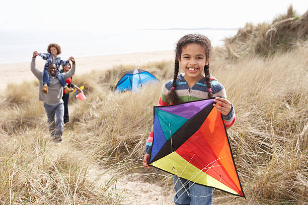 istock Family Having Fun With Kite In Sand Dunes 126046076