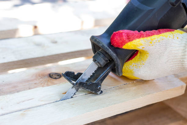 istock sawing boards with a band saw. 1260472721