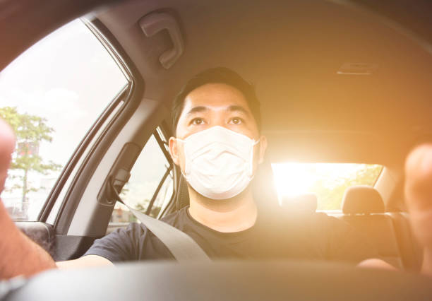 istock Man wearing mask is driving 1260475413