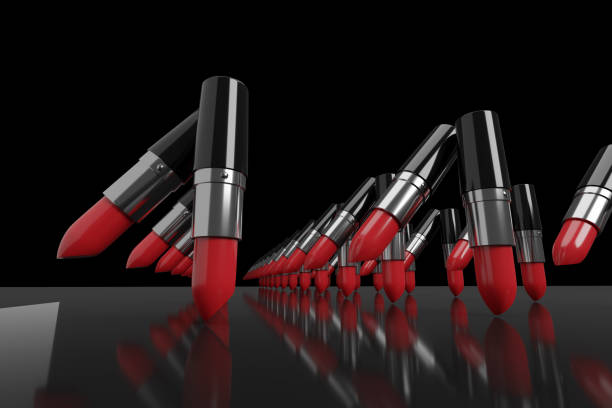 istock Red lipsticks marching in a row on a black background. 3d illustration. 3d illustration. 1260488214