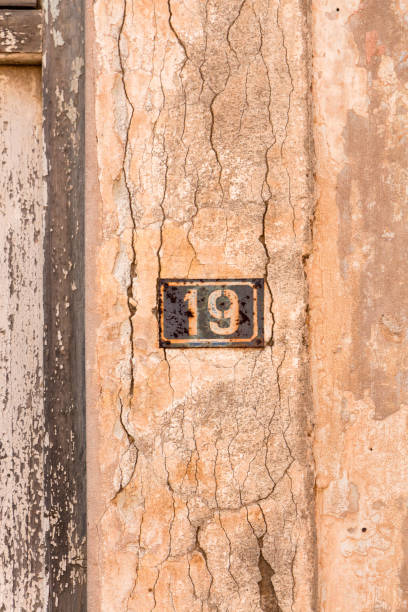 istock Number 19 on wall sign, rusty and weathered. 1260489822