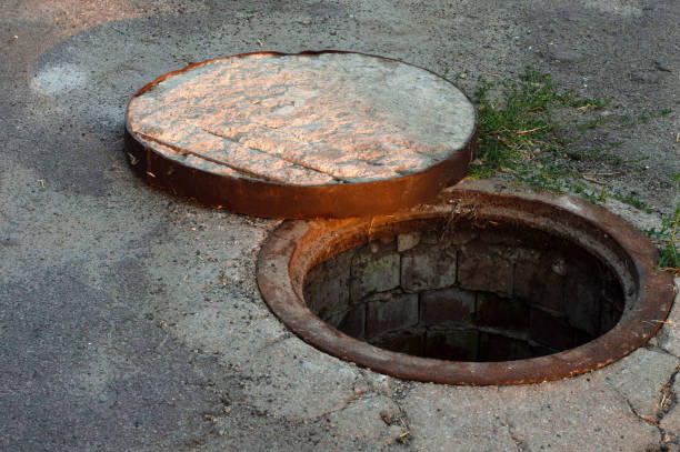 istock Open street sewer hatch with concrete cover 1260495181