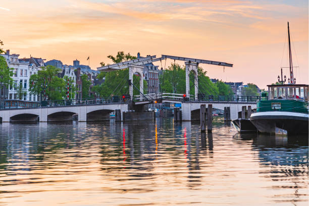 istock Amsterdam streets and canals during dusk 1260495187