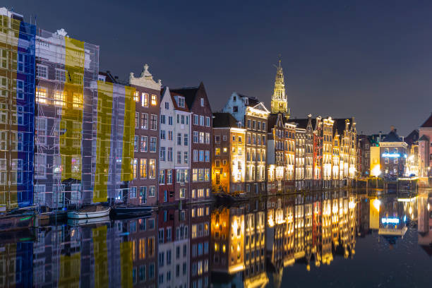 istock Amsterdam Damrak traditional Dutch architecture at night 1260495191