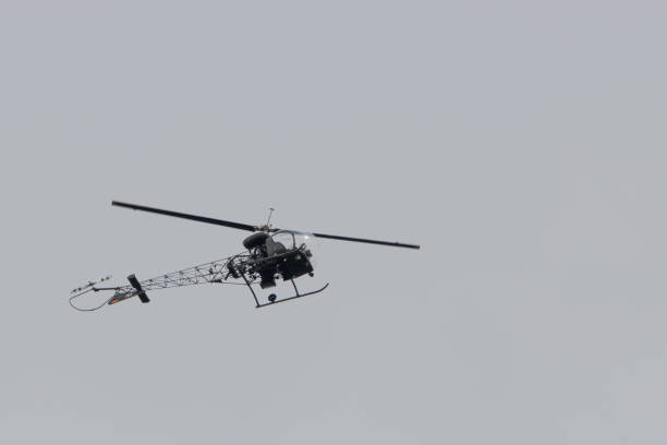 istock a small helicopter with tubular frame flies in the sky 1260501763