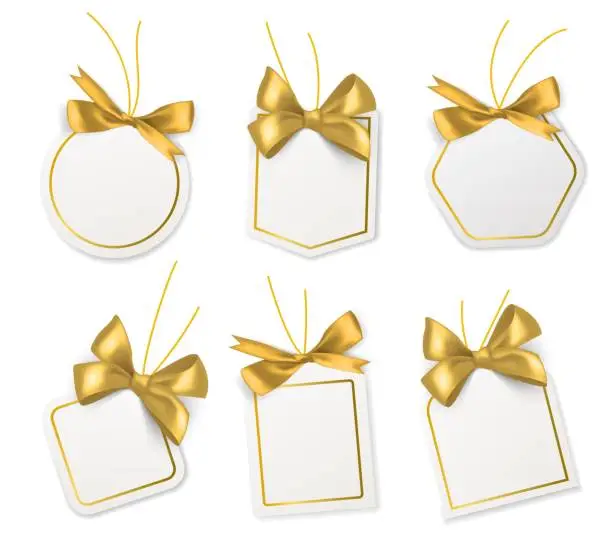 Vector illustration of Tags with gold bows. Blank white price paper labels with golden ribbons for christmas, birthday or wedding packaging gift vector realistic isolated templates collection