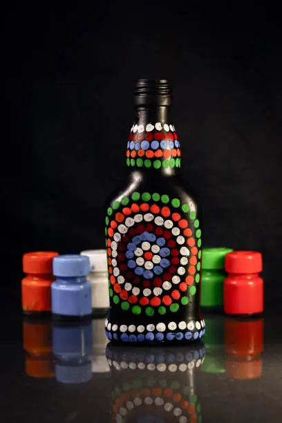 Photo of Bottle art with Set of paints and  brushes for painting