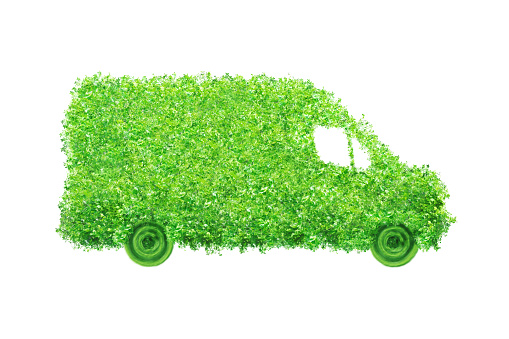 Isolated delivery van made of leaves. Electric cargo car, transportation and environmental concept.