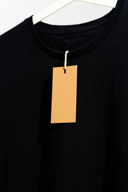 istock Black t-shirt with blank price tag on hanger 1260542934