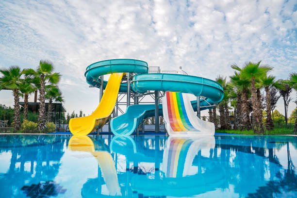 Water slide at water park. swimming pool at luxury hotel stock photo