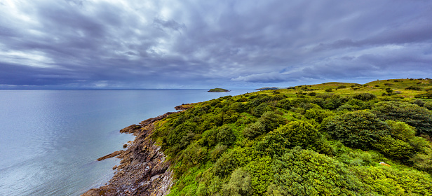 The view from the land of a stretch of sea known as the Solway Firth. The location is in Dumfries and Galloway, south west Scotland. The image was created by merging several images captured by a drone.