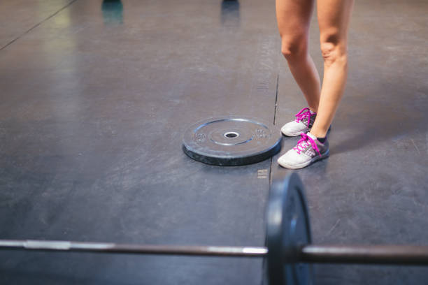 istock Weigh and barbell in gym 1260568924