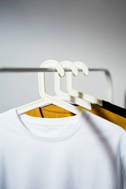 istock T-shirts displayed on clothes rack 1260569468