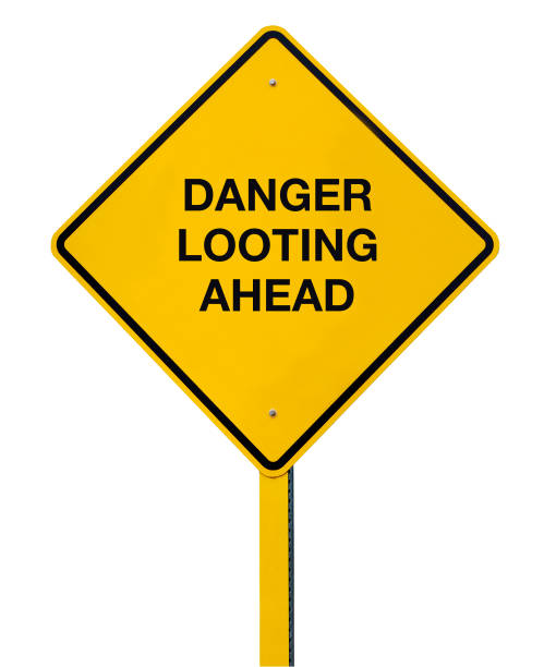 istock Road Sign isolated against a white background: Danger Looting Ahead 1260576216