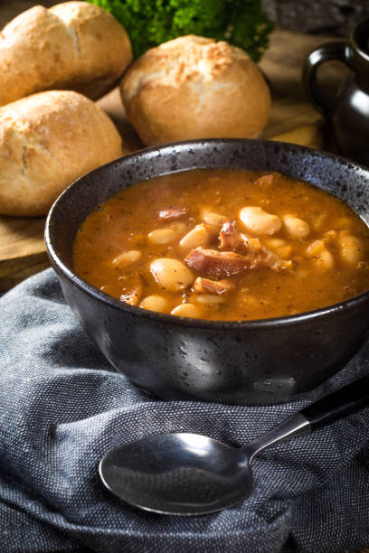 istock Beans with tomato sauce, bacon and sausage. 1260577326