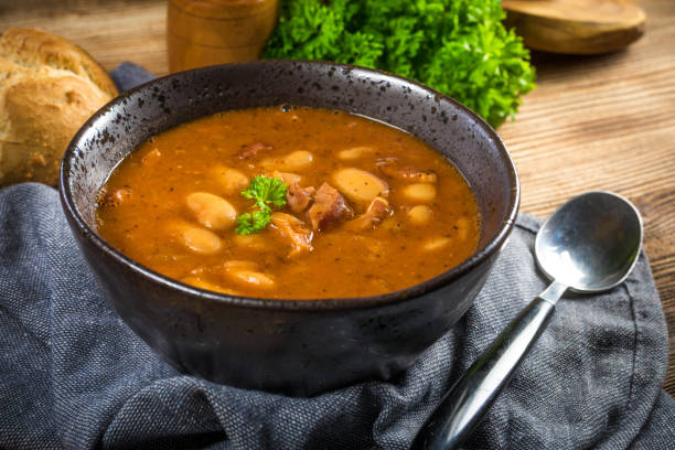 istock Beans with tomato sauce, bacon and sausage. 1260577897