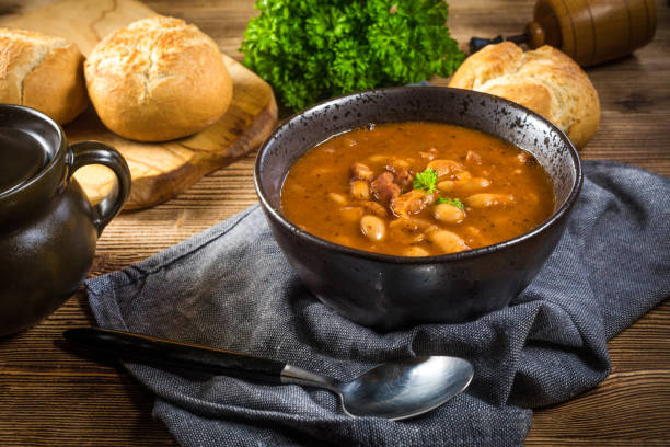 istock Beans with tomato sauce, bacon and sausage. 1260578421
