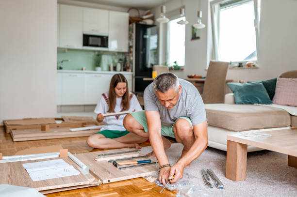 istock Father and daughter assembling a new furniture 1260588789