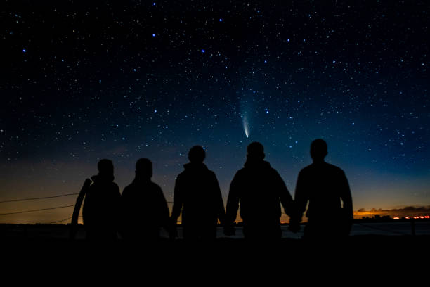 Photo of Friends in front of nightsky and C/2020 F3 comet 