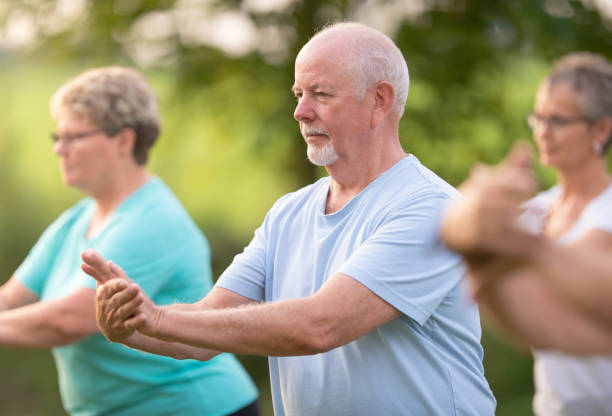 istock Senior learning tai chi outdoors 1260600306