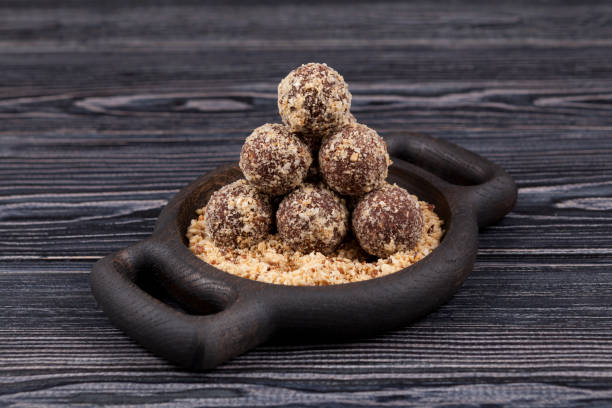 istock Oat balls. Energy balls with dates and nuts. Wooden background, selective focus 1260601991