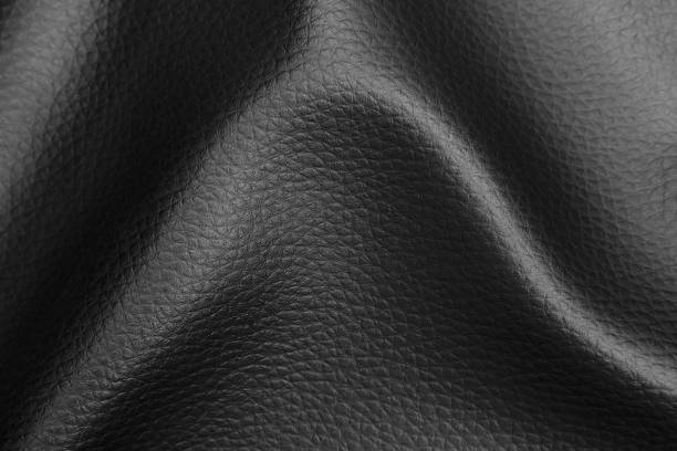 istock Abstract background of creased black leather fabric. 1260610130