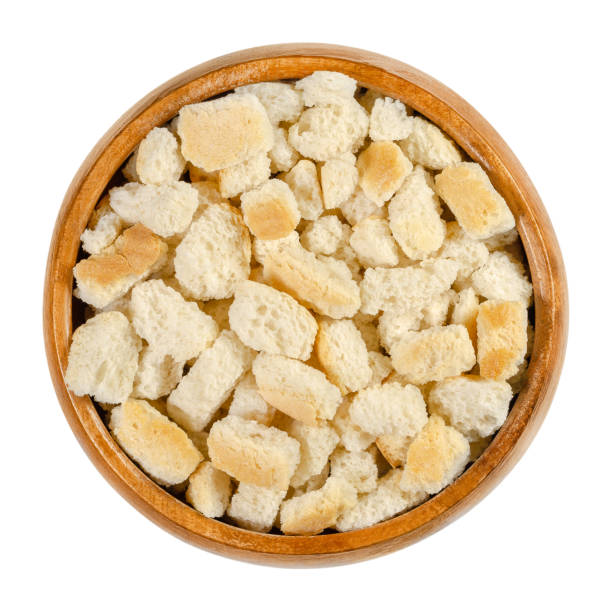 istock Dry bread cubes for stuffing in a wooden bowl 1260614875