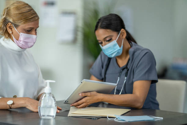 istock Masked Medical Appointment 1260643558