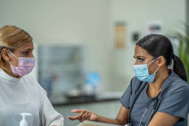 istock Masked Medical Appointment 1260644042