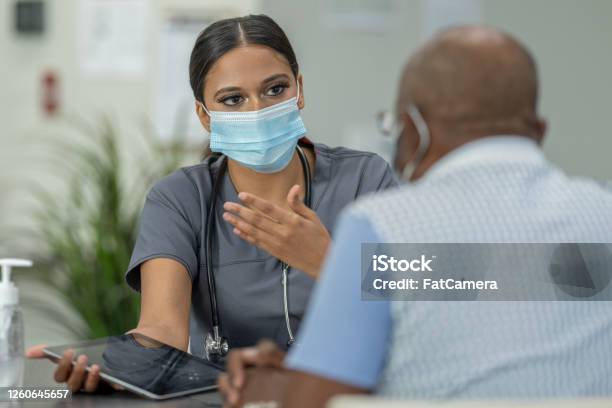 Masked Medical Appointment Stock Photo - Download Image Now - Patient, Protective Face Mask, Nurse