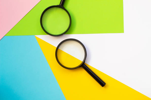 istock Magnifying glass against colorful pastel background flat lay minimal creative concept. 1260646190