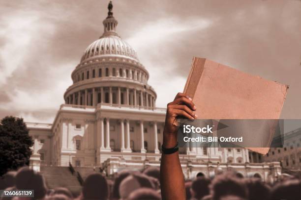 Blank Sign At Protest At City Street With Man Holding Sign In Crowd By Capitol Building Washington Dc Stock Photo - Download Image Now