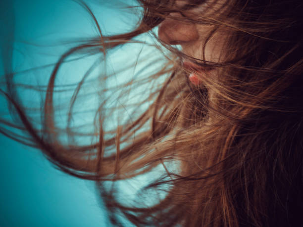 Hair blowing in the wind stock photo