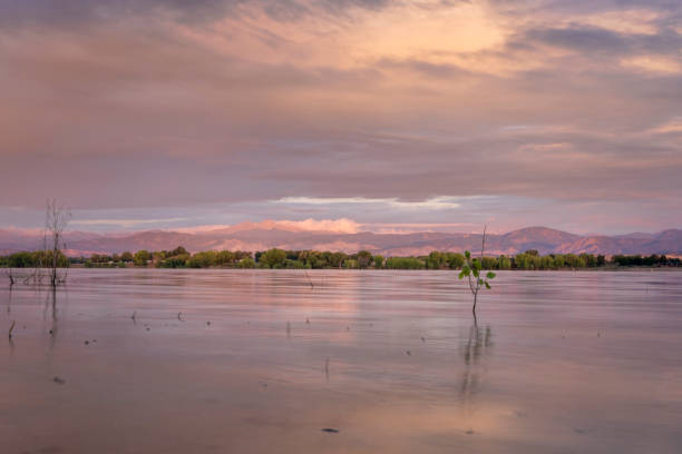 istock summer dawn over Boyd Lake and Front Range of Rocky Mountains 1260704500