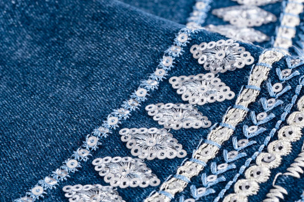 istock Women's Blue Jeans Pants Cuffs With Decorative Designs and Stitchings 1260716381
