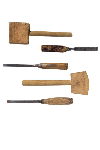 istock Three old chisels and Two old wooden mallet. Isolated on a white background 1260718460