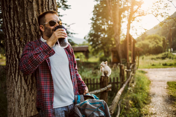 istock A young mountaineer takes a break from hiking 1260718975