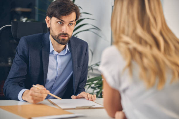 istock Bearded young man discussing project with business colleague 1260735182