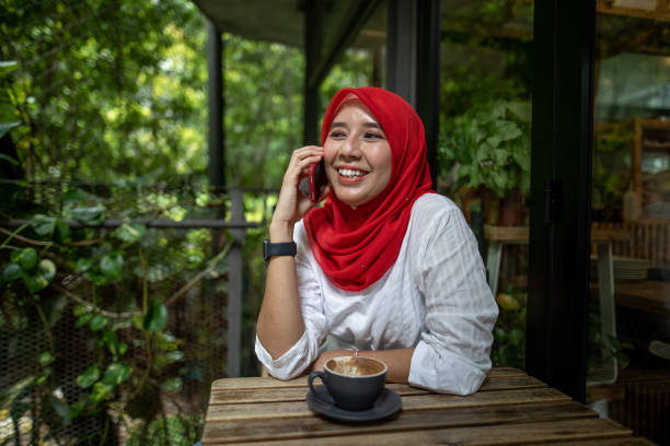 Asian women talking and using phone