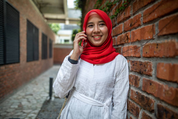 istock Asian women talking and using phone 1260740895