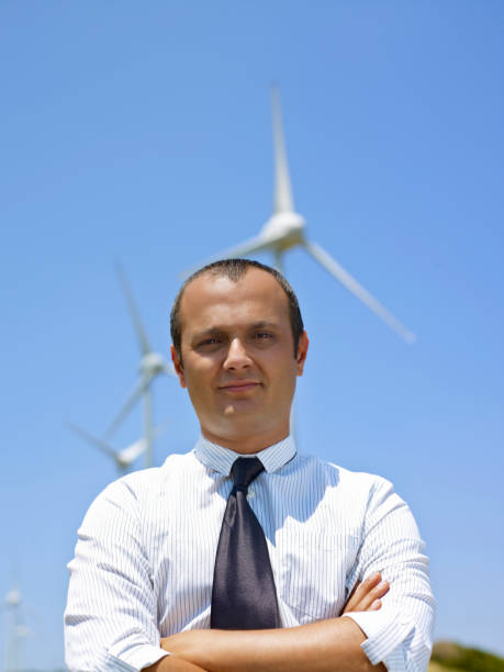 istock Businessman and wind turbines 1260742430