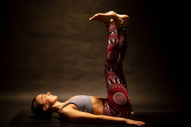 istock Young female yogi assumes gentle inversion 1260776011