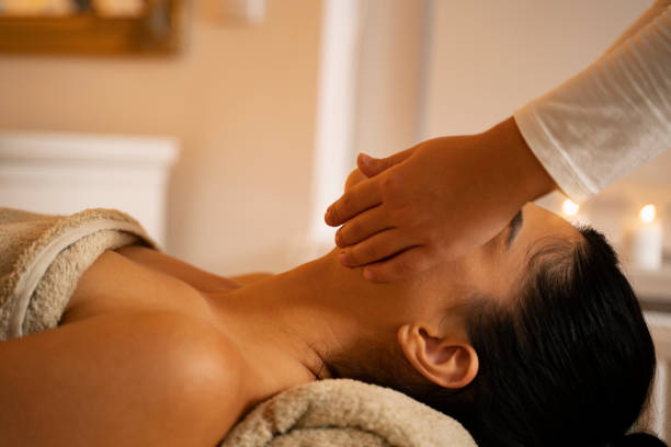 istock unrecognizable young woman having face massage 1260786724