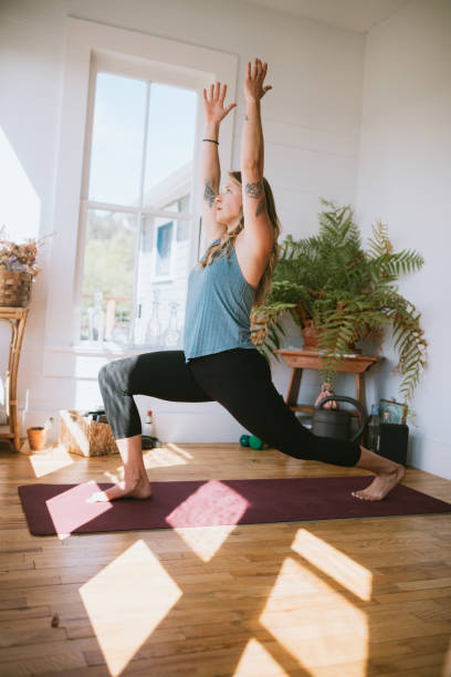 istock Young Woman Practicing Yoga At Home 1260809429